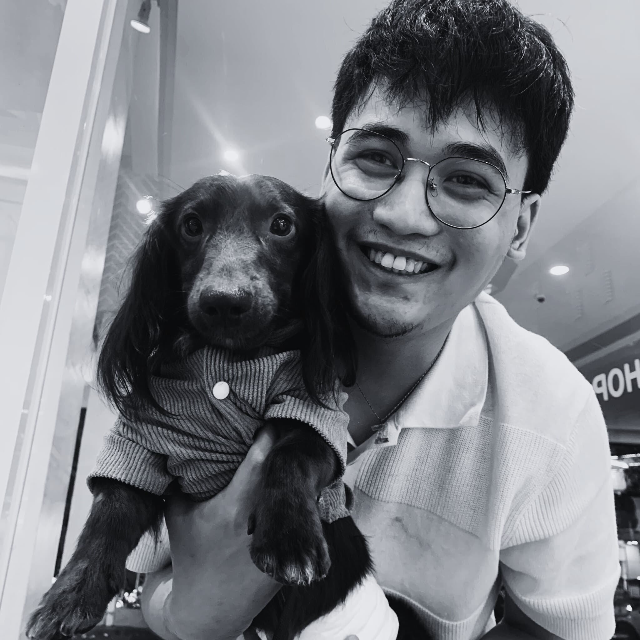 Christian Masangkay holding his dog